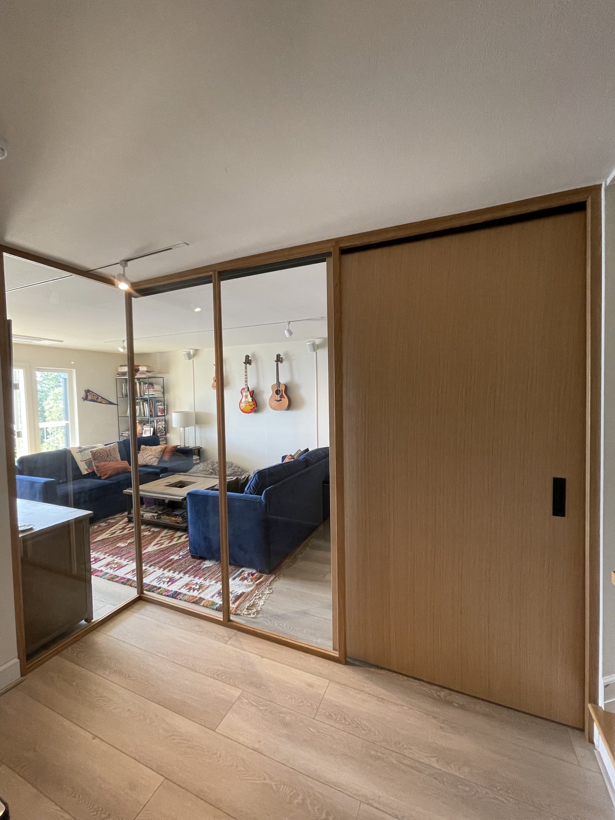 Custom wood-framed glass sliding door, closed